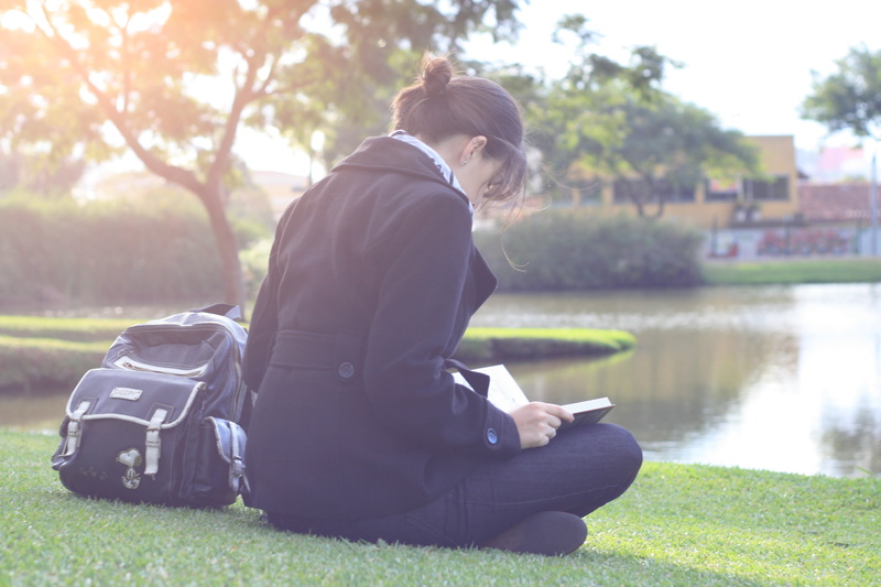backpack, foliage, spring, sitting, river, young Adult, rays, caucasian Ethnicity, beautiful, enjoyment, apartments, grass, adult, girl, learning, brunette