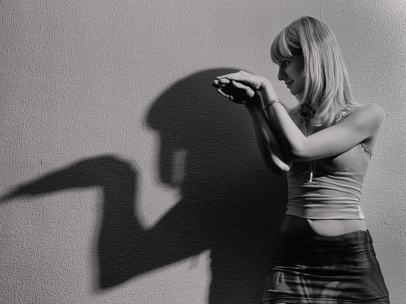 facial expression, fashion, wear, recreation, fringe, black and white, person, portrait, violence, hair, girls, people, emotion, young women, child, punching