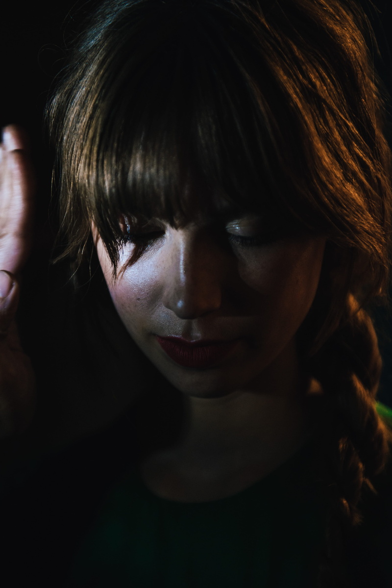 women, woman, hair, night, real people, black background, headshot, one person, hairstyle, fringe, light, focus on foreground, indoors, bangs, female, young adult