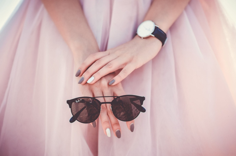 accessories, body part, finger, midsection, sunglasses, woman, day, ring, pink color, indoors, ray ban, caucasian, nail, hands, women, one person, watch