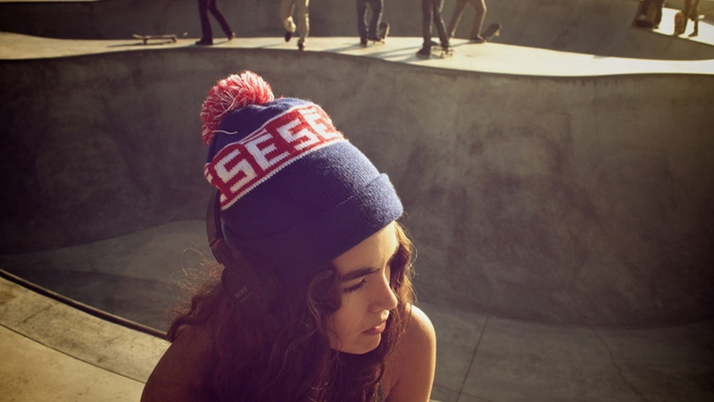 indoors, human body part, sitting, child, girl, young adult, cap, clothing, hair, white, brunette, portrait, blue, hat, bobble, high angle view, red, lifestyles