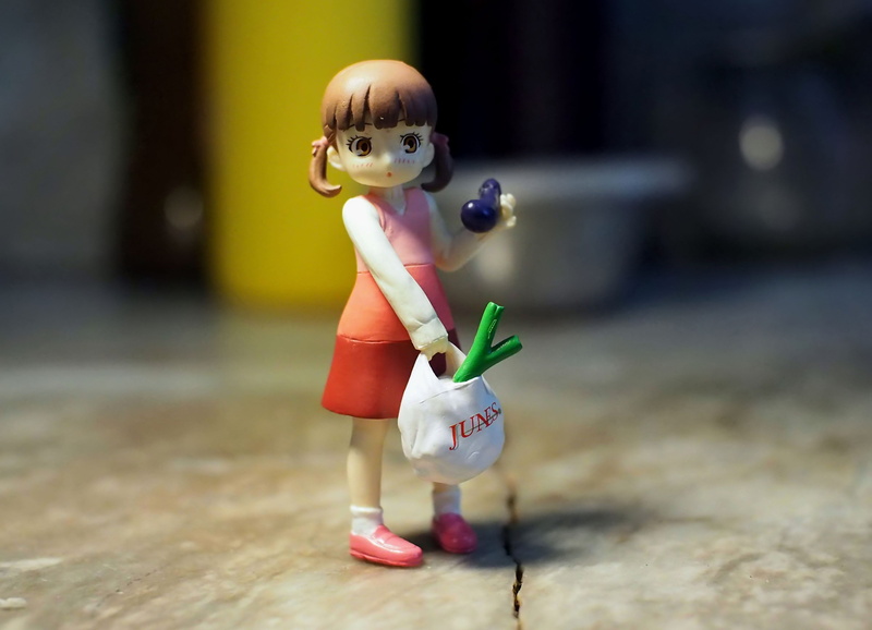day, single object, girl, figurine, doll, small, focus on foreground, close-up, character, innocence, selective focus, cute, still life, japanese, toy