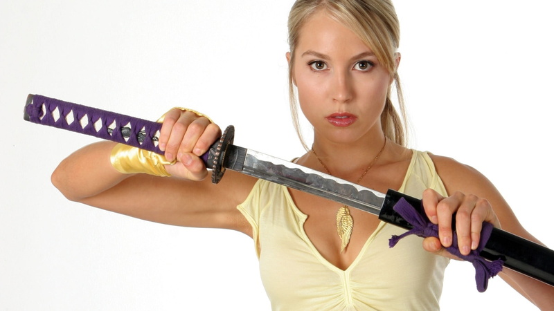 looking at camera, aggression, cut out, young women, hair, actress, holding, communication, indoors, white background, weapon, necklace, tank top, young adult