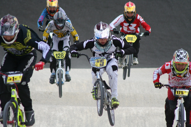 clothing, biking, day, headwear, Competition, sports Venue, sports Helmet, motorcycle, motion, outdoors, full length, sports Team, young, winning, competing