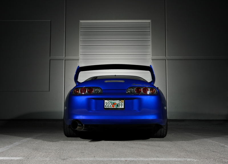 shadow, toion, toyota, mode of transportation, communication, wall - building feature, single object, number, illuminated, indoors, 2K, supra, speed, no people