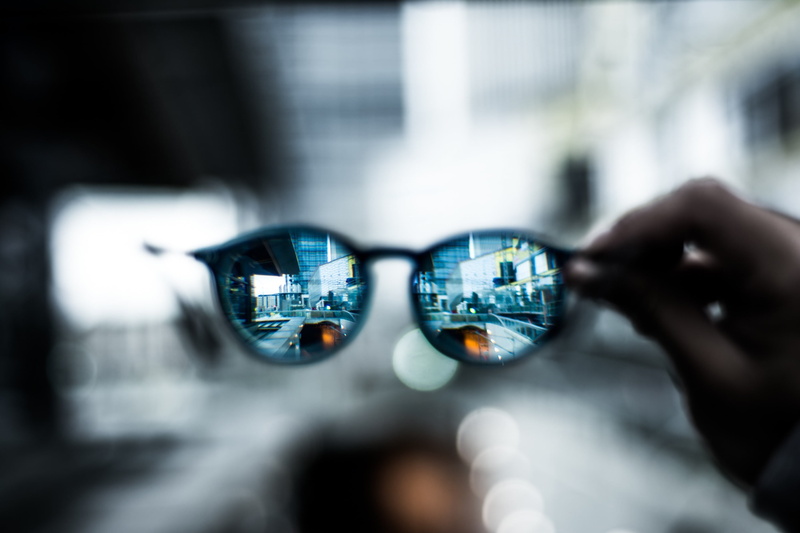 close-up, depth of field, selective focus, black, sunglasses, one person, reflection, finger, bokeh, architecture, blurred, focus on foreground, luxury