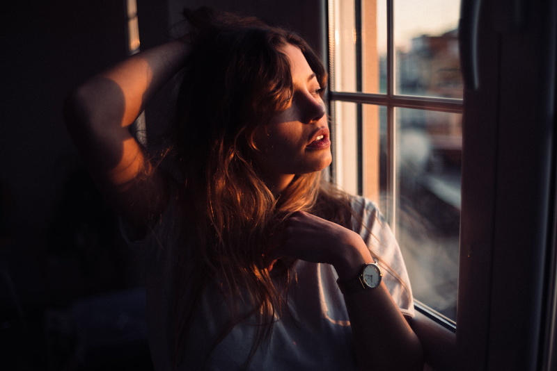 indoors, sunset, hand on head, André Josselin, window, watch, women indoors, brunette, long hair, depth of field, looking out window, looking away, model