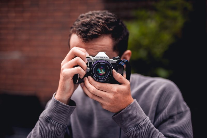 front view, occupation, adult, camera, selective, person, males, photography themes, blue, 5K, photography, wall, photographer, taking, headshot, holding