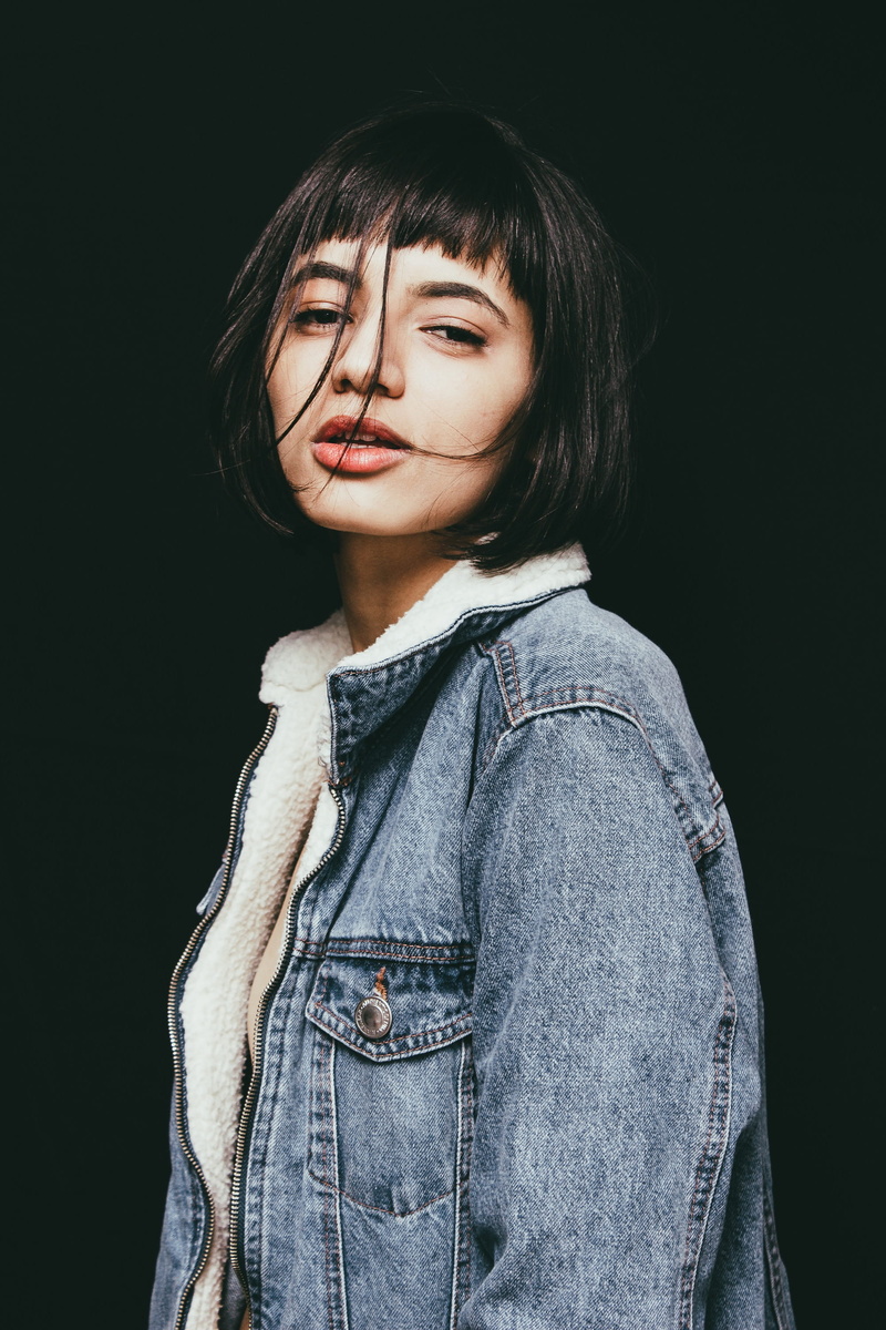 pretty, casual clothing, close-up, bangs, lifestyles, indoors, youth, fashionable, hairstyle, front view, wearing, photoshoot, human, studio, denim jacket