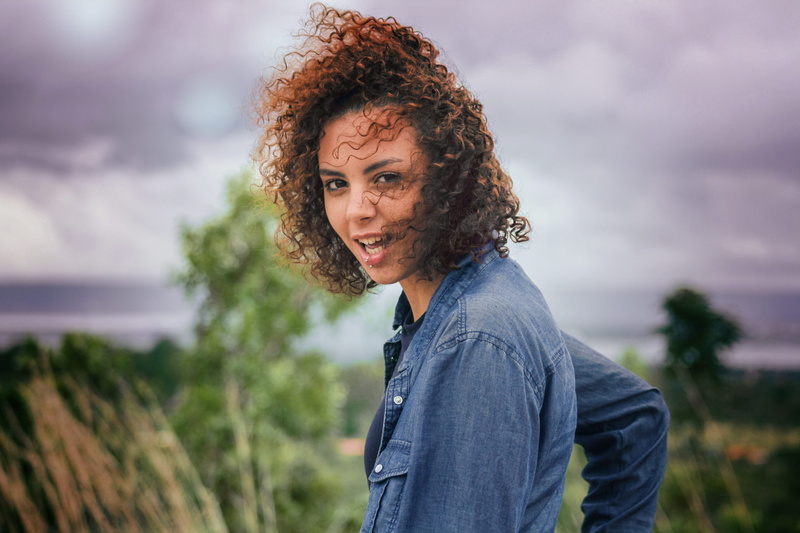 beautiful people, curly hair, hairstyle, woman, smiling, outdoor, outdoors, 4K, casual clothing, blue, gray, beauty, beautiful woman, standing, adult