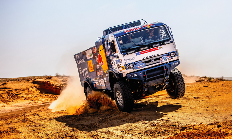 outdoors, clear sky, off-road vehicle, mode of transportation, no people, landscape, sunlight, nature, Kamaz, vehicle, dirt, transportation, land vehicle