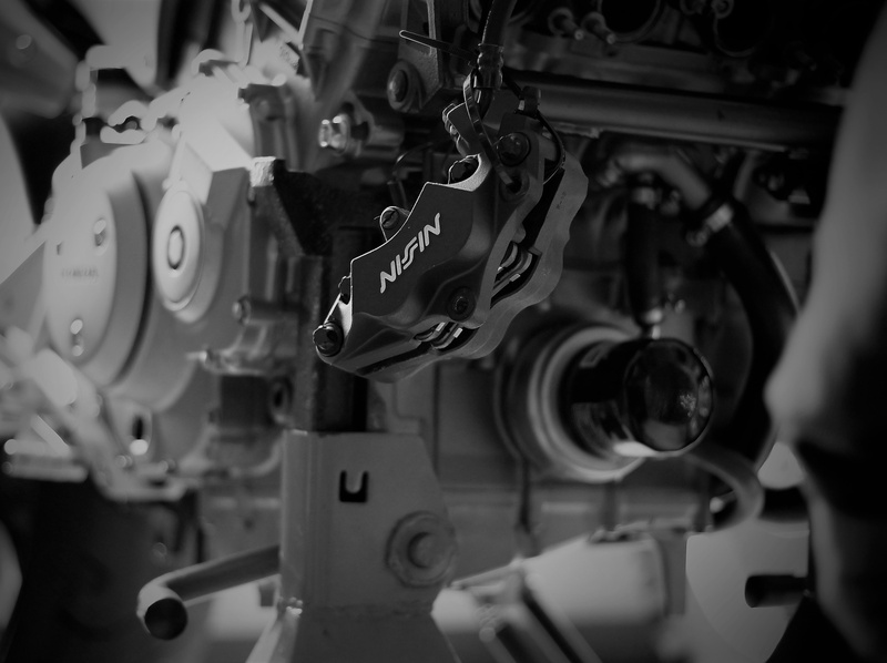 machinery, vehicle part, selective focus, machine valve, honda cb900f, wheel, indoors, technology, shopping, transportation, focus on foreground, engine mounting