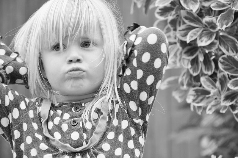offended, looking at camera, offspring, polka dot, cute, white, portrait, hairstyle, bangs, human face, pout, defiant, black, childhood, pattern, polka