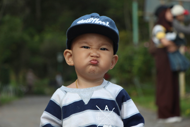 kids, striped, day, portraint, people, front view, headshot, portrait, lifestyles, toddler, real people, boy, cap, males, focus on foreground, anger, shirt