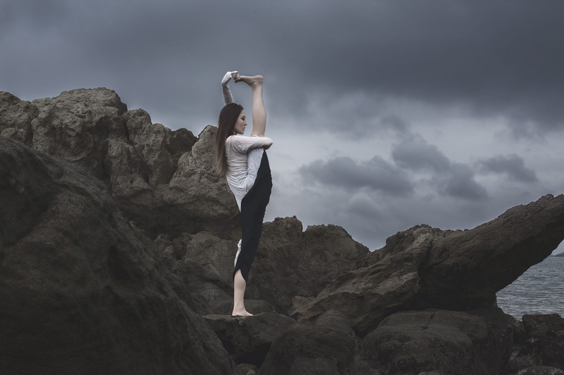 rock formation, solid, top, young adult, sky, lifestyles, cloudy, hayama, young women, dance pose, outdoors, rock - object, leisure activity, adult, japan