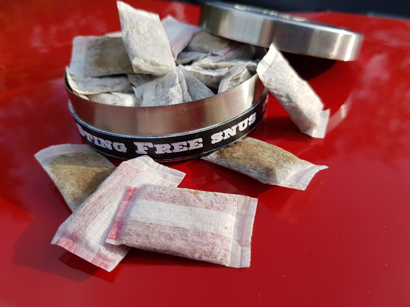 no people, red, celebration, chew bag, focus on foreground, snuff, snus portion, portion snus, cube shape, nuuska, thr, still life, close-up, metal, kitchen utensil