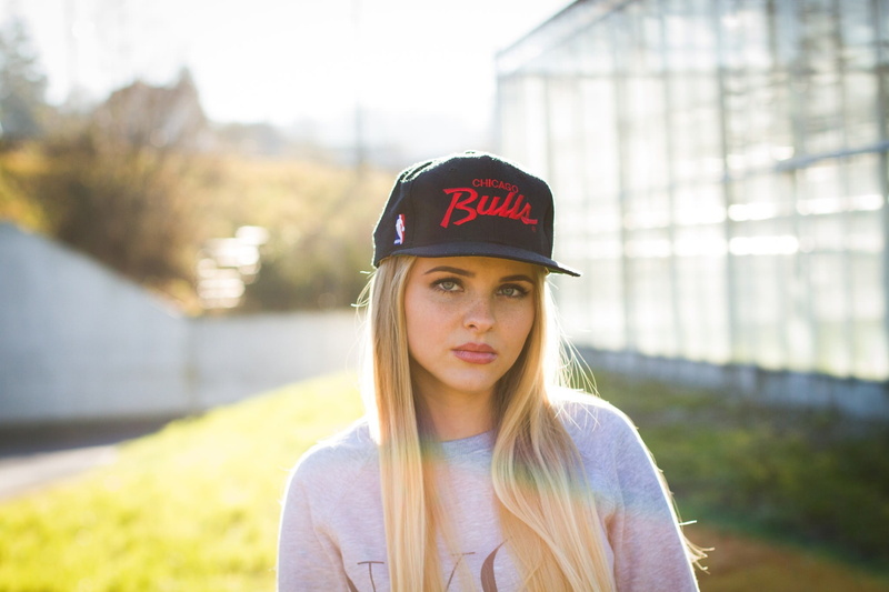 clothing, looking, 1080P, cap, teenager, long hair, day, hairstyle, portrait, baseball caps, outdoors, women, front view, headshot, one person, face, looking at camera