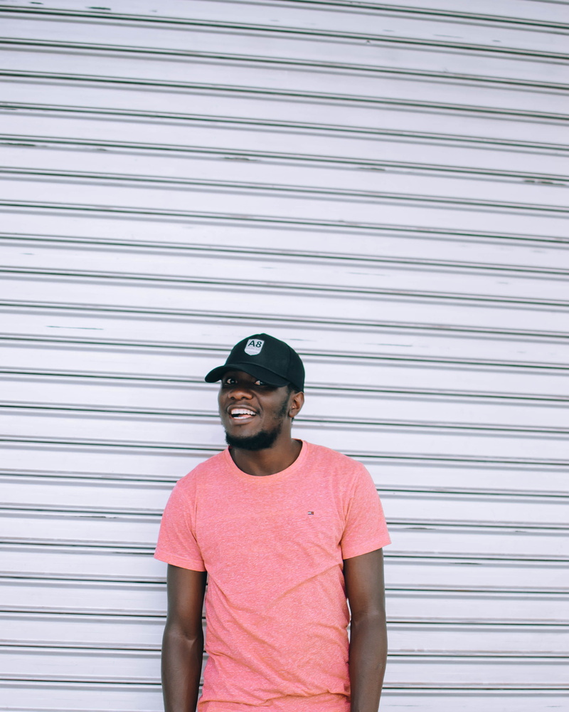 corrugated iron, photoshoot, teenager, model, young men, wall - building feature, adolescence, adult, casual clothing, one person, standing, baseball cap