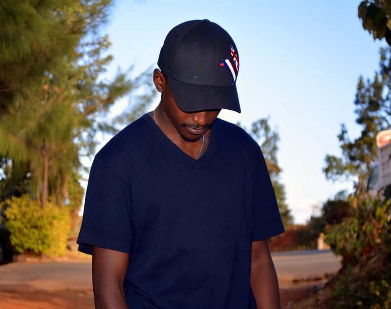 cap, nature, wearing, 4K, black, front view, person, neck, lifestyles, boy, wear, outdoors, t, leisure activity, focus on foreground, looking, man, men