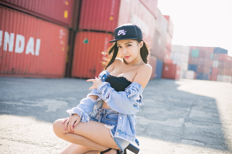women, jean shorts, looking at viewer, jeans jacket, baseball caps, black tops, model, 1080P, women outdoors, Nike, container, brunette, bare shoulders
