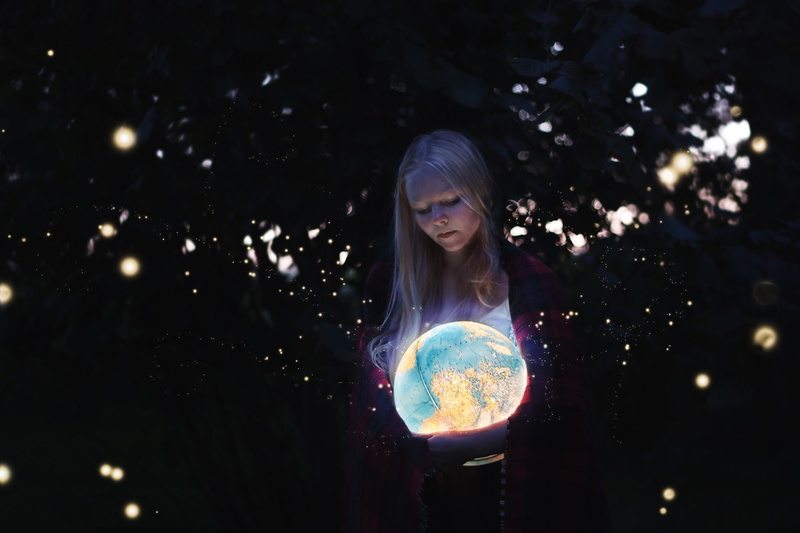 teenager, fantasy, one person, outdoors, night, casual clothing, sphere, young adult, globes, hairstyle, real people, illuminated, lights, looking at camera
