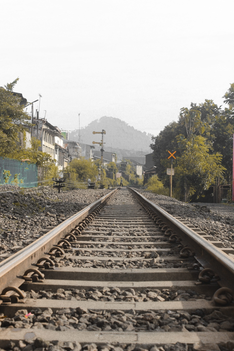 sky, dirt road, sundial, long, day, sidewalk, path, road, pavement, railway, architecture, parallel, railroad track, mode of transportation, direction