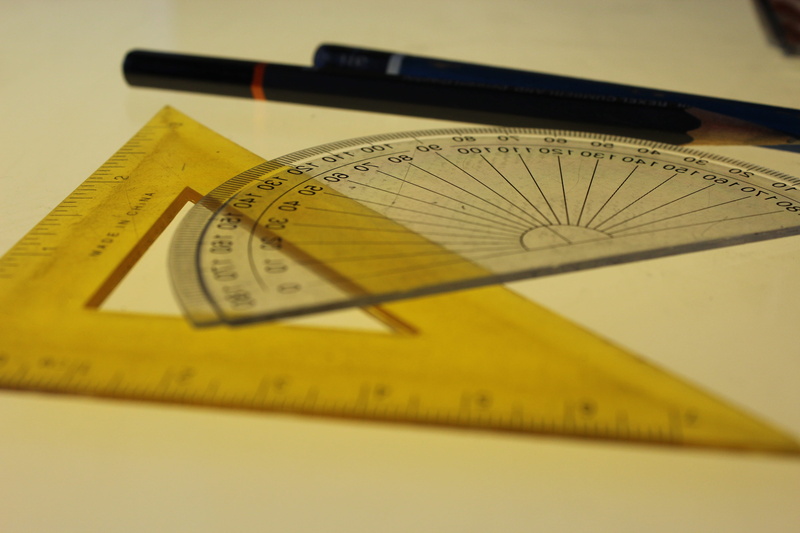 writing instrument, yellow, sundial, guidance, wood, high angle view, jewelry, 5K, label, small group of objects, compass math, map, table, close-up, plywood