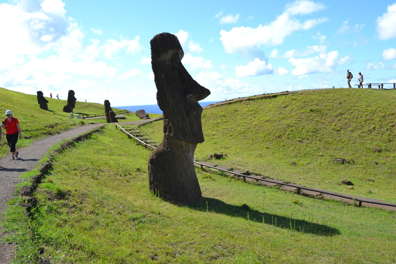 the past, moai, field, rapa nui, boundary, outdoors, land, cloud - sky, day, environment, landscape, grass, incidental people, easter island, sky, beauty in nature