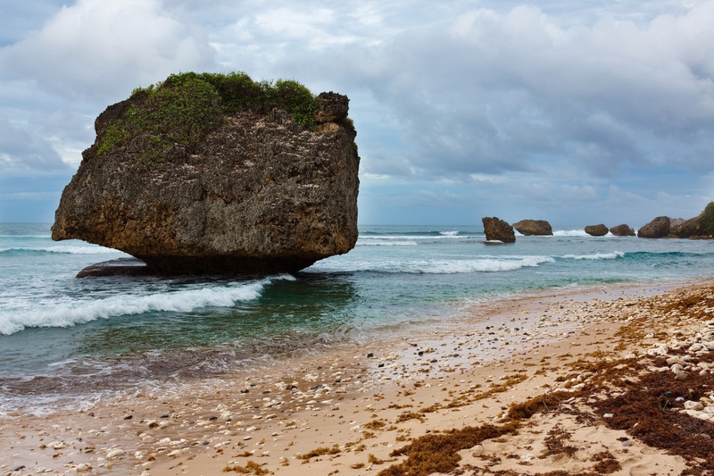 huge, rock formation, daytime, tranquil scene, non-urban scene, day, land, stack rock, cloud - sky, rock - object, caribbean, sky, sand, stone, ocean, outdoors