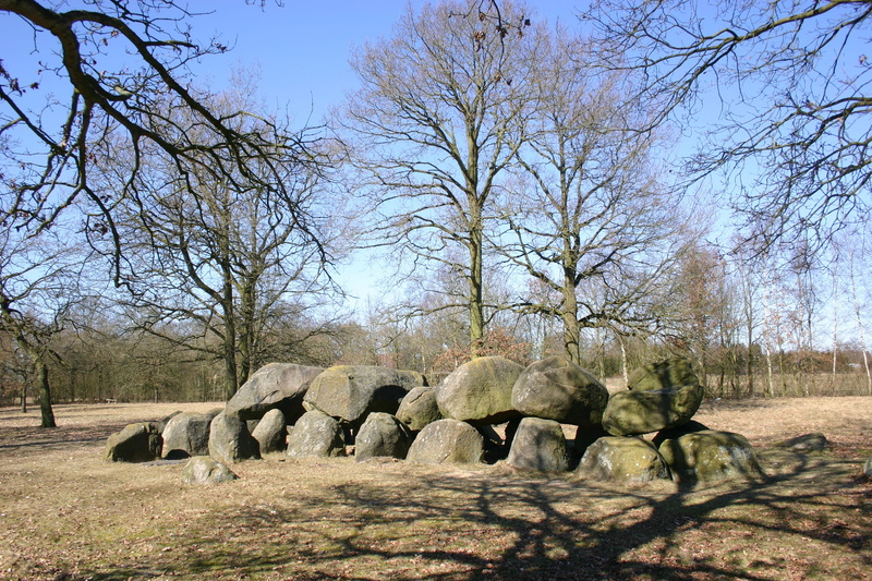 no people, outdoors, bare tree, land, hay, beauty in nature, dolmen, nature, solid, rock, tranquil scene, environment, non-urban scene, sky, branch, day