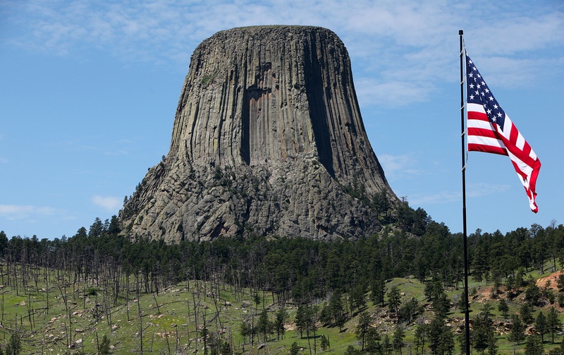 cloud - sky, travel destinations, mountain, sky, wyoming, tree, patriotism, devils tower, land, travel, low angle view, no people, environment, beauty in nature