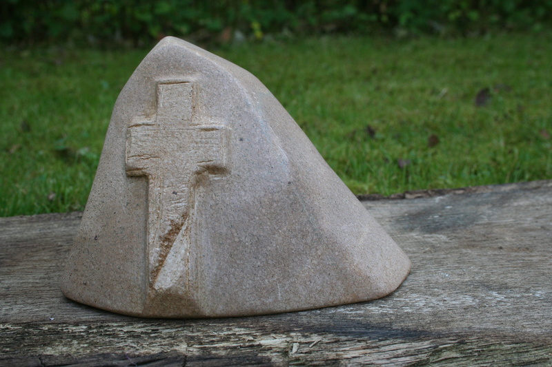 day, grass, outdoors, craft, shape, solid, funeral place, no people, creativity, plant, mourning, human representation, last calm, stone cross, nature