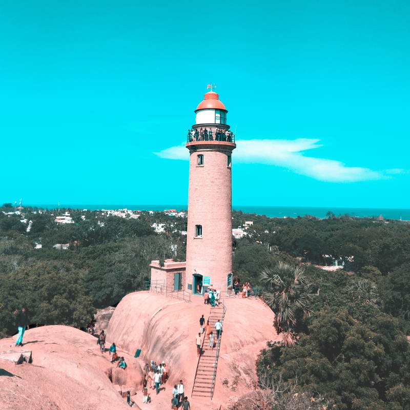 architecture, sky, india, security, street, blue, built structure, sand, beacon, gray, white, incidental people, countryside, mahabalipuram, urban, alley
