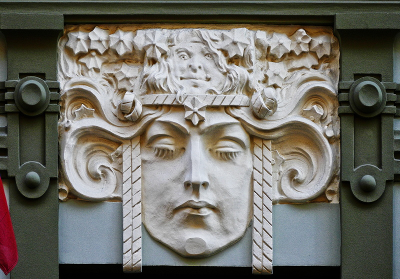 playfulness, carving - craft product, close, house facade, architecture, mid, secessionists, built structure, bas relief, human representation, entrance