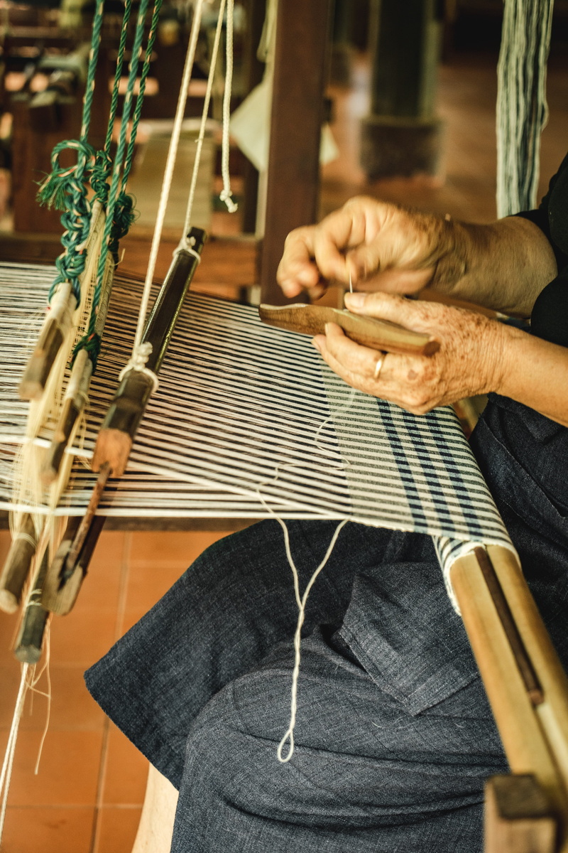traditional, musical equipment, skill, music, fabric, handmade, pattern, one person, handwork, weaving, creativity, loom, thread, real people, work, human body part