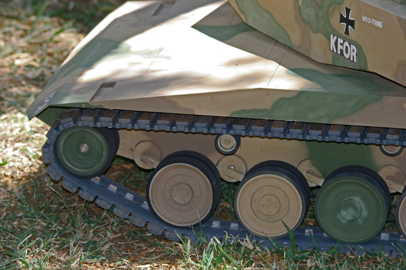 artistry, authentic, western script, handwork, army, mode of transportation, land, wheel, plant, text, camouflage, detail, skill, armored Tank, transportation