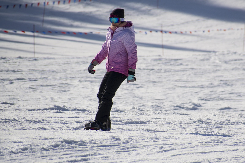 winter sports, real people, snow, mountains, skiing, Winter, day, clothing, pink, recreational Pursuit, sunny day, rear view, winter Sport, cold - Temperature