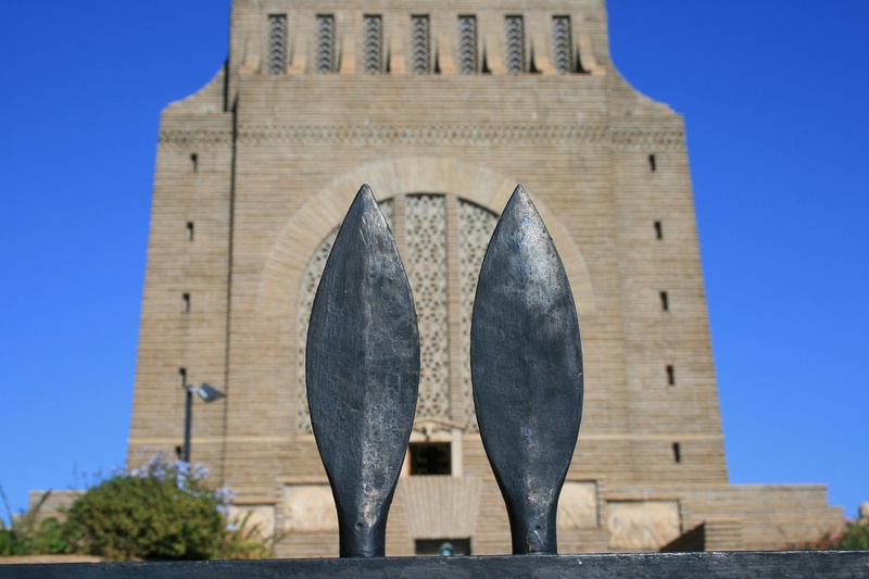 no people, resemblance, sculpture, weapon, office building exterior, low angle view, nature, building, skyscraper, background, the past, building exterior