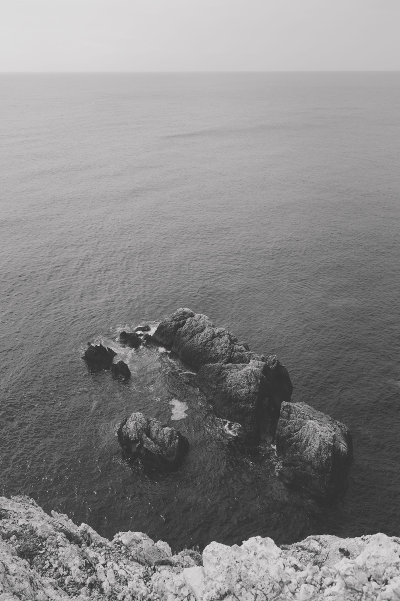 rock - object, nature, outdoors, tranquil scene, day, rocks, cliff, no people, summer, ionian see, august, lefkada, black and white, holiday, monochrome