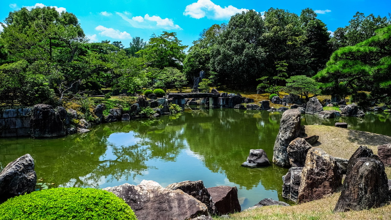 lake, day, scenics - nature, water, architecture, green color, tranquility, solid, scenics, reflection, puddle, tree, tranquil scene, nature, rocks, plant