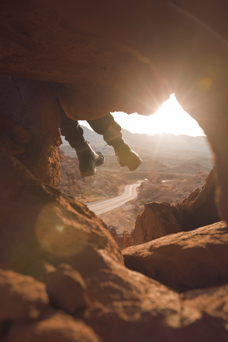 tranquil scene, background, golden, physical geography, cave, beauty in nature, nature, sunset, black, sun, sky, tranquility, highway, person, boots, wearing