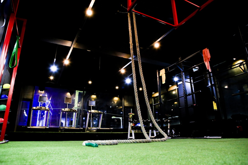 grass, rope, night, outdoors, street, exercise, green color, cross fit, no people, illuminated, health, lighting equipment, park, architecture, low angle view