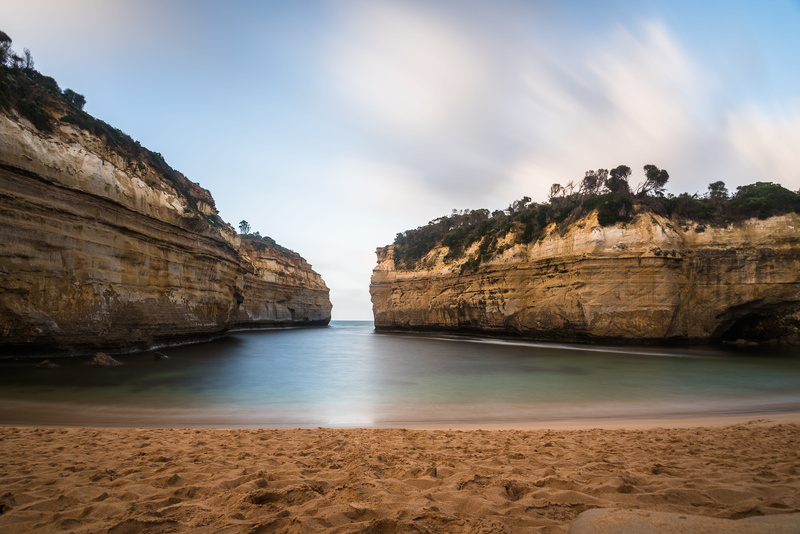 cloud - sky, non-urban scene, solid, cliff, formation, rock - object, scenics - nature, outdoors, tranquil scene, sky, rock formation, clouds, no people