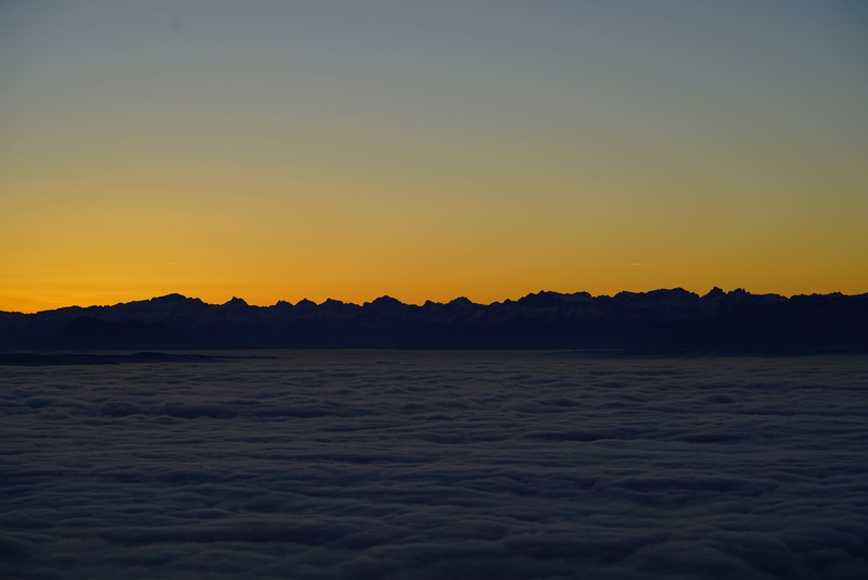 cloud cover, panoramic photo, orange color, waterfront, scenics, alpine, clear sky, water, outdoors, sky, scenics - nature, alps, silhouette, sunrise, beauty in nature