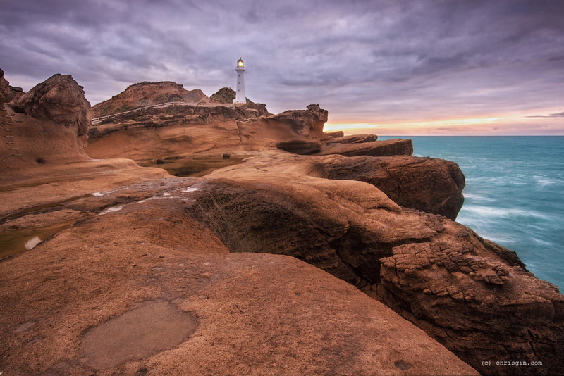 top, lighthouse, 480P, brown, rock - Object, brown mountain, day, white, on top, nz, wairarapa, cliff, mountain, coastline, time, Castlepoint, sea, new