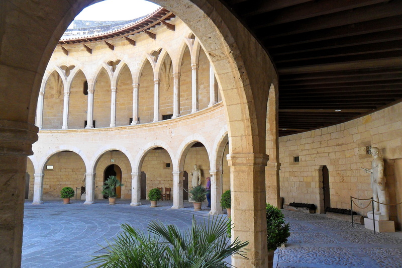 outdoors, arcade, building, entrances, stone wall, day, majorca, beige, dome, sculpture, castle, tour, the stones, building exterior, sunlight, built structure