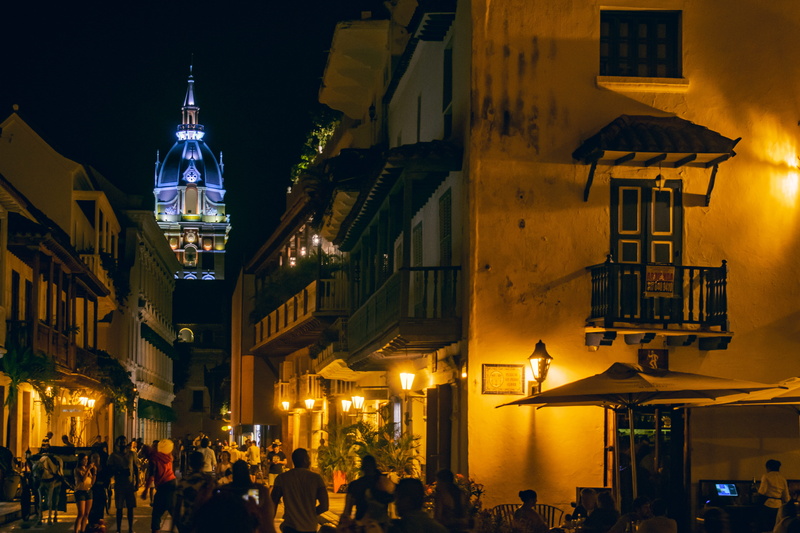 illuminated, travel, building exterior, architecture, women, group of people, street, parroquia san pedro claver, colombia, cartagena, real people, catedral