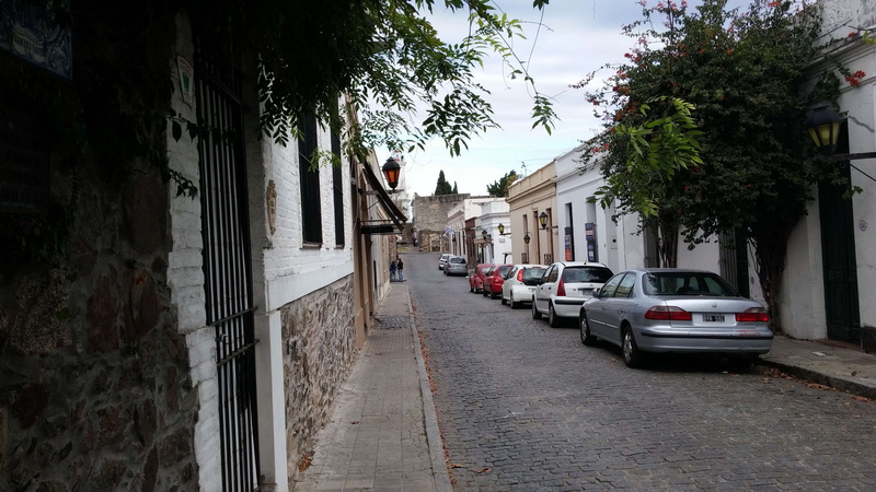 built structure, direction, building exterior, colonia uruguay colonial city, car, city, land vehicle, the way forward, plant, residential district, road