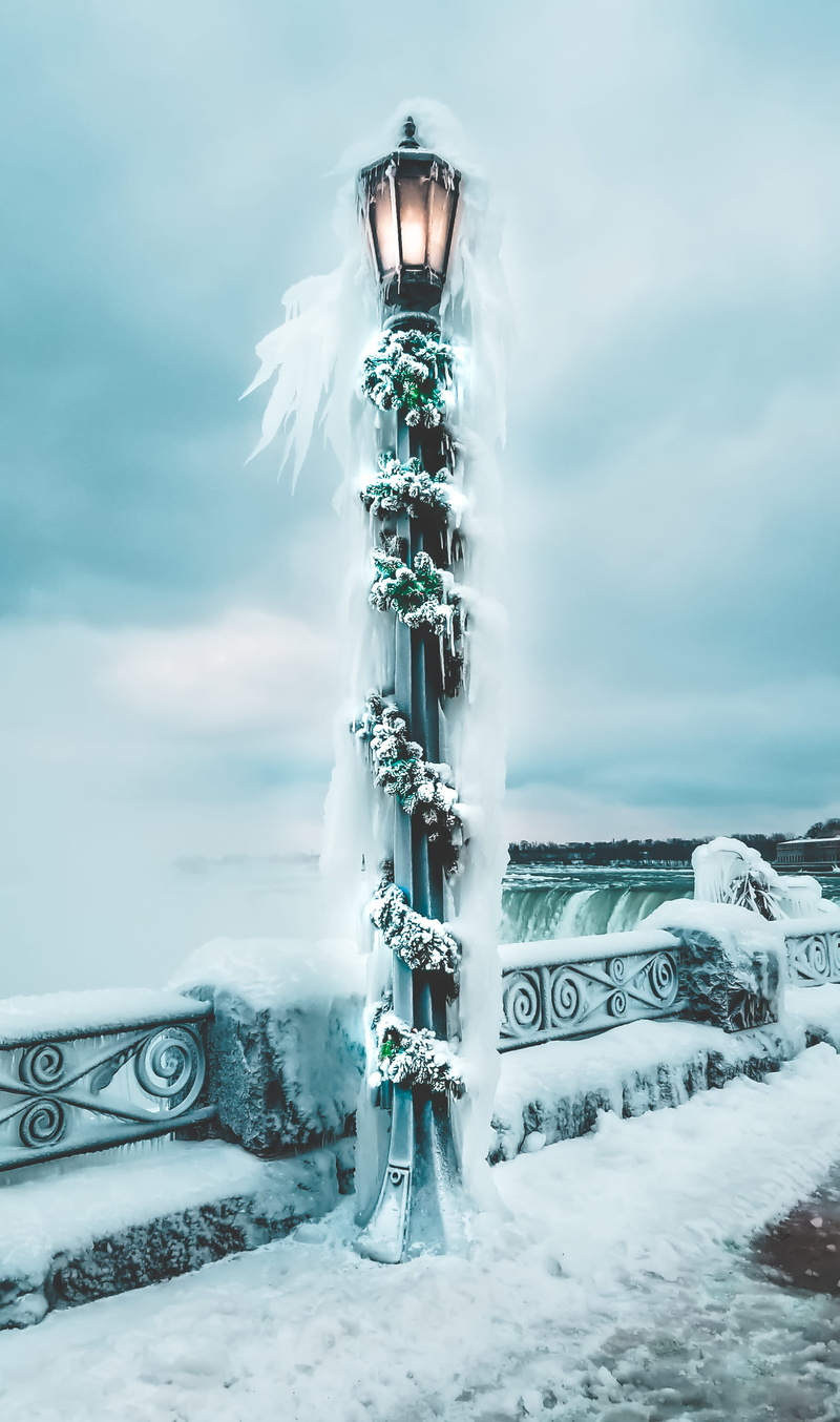 snowstorm, blurred motion, motion, black, outdoor, cloud - sky, architecture, day, ice, frigid, light, light post, lamp, snow, sky, blue, gray, cold temperature