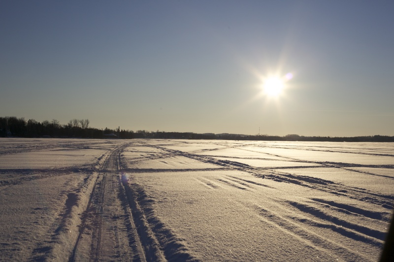 tranquility, icy, scenics - nature, tire track, sunlight, outdoors, land, frozen, lens flare, environment, 2K, no people, sun, cold temperature, sky, trail